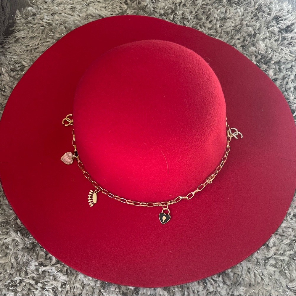Red juicy couture brim hat with charms.